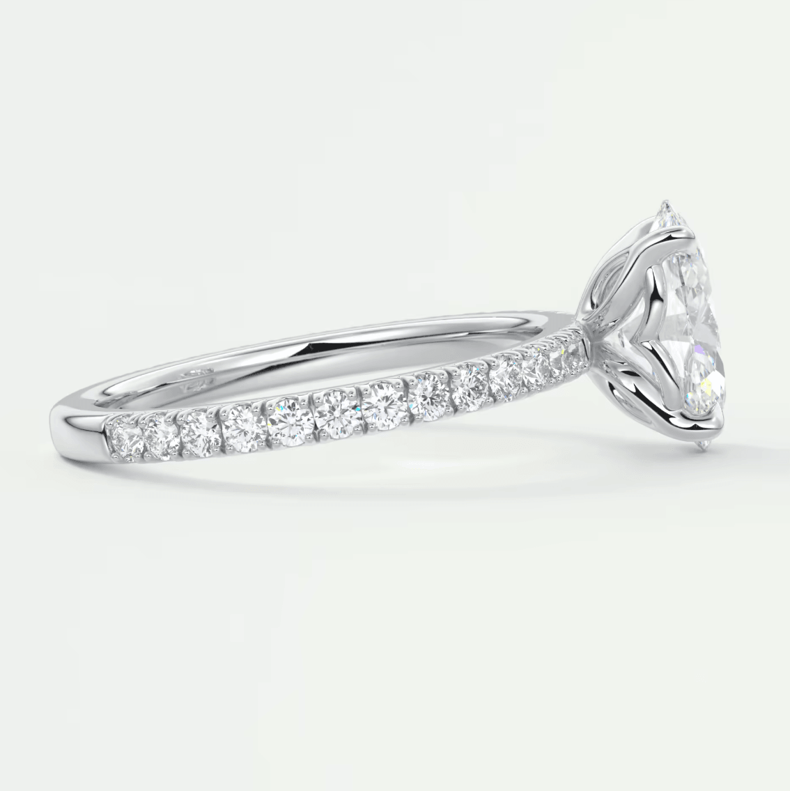 18k white gold diamond engagement ring with a marquise-cut center stone and channel-set side diamonds.