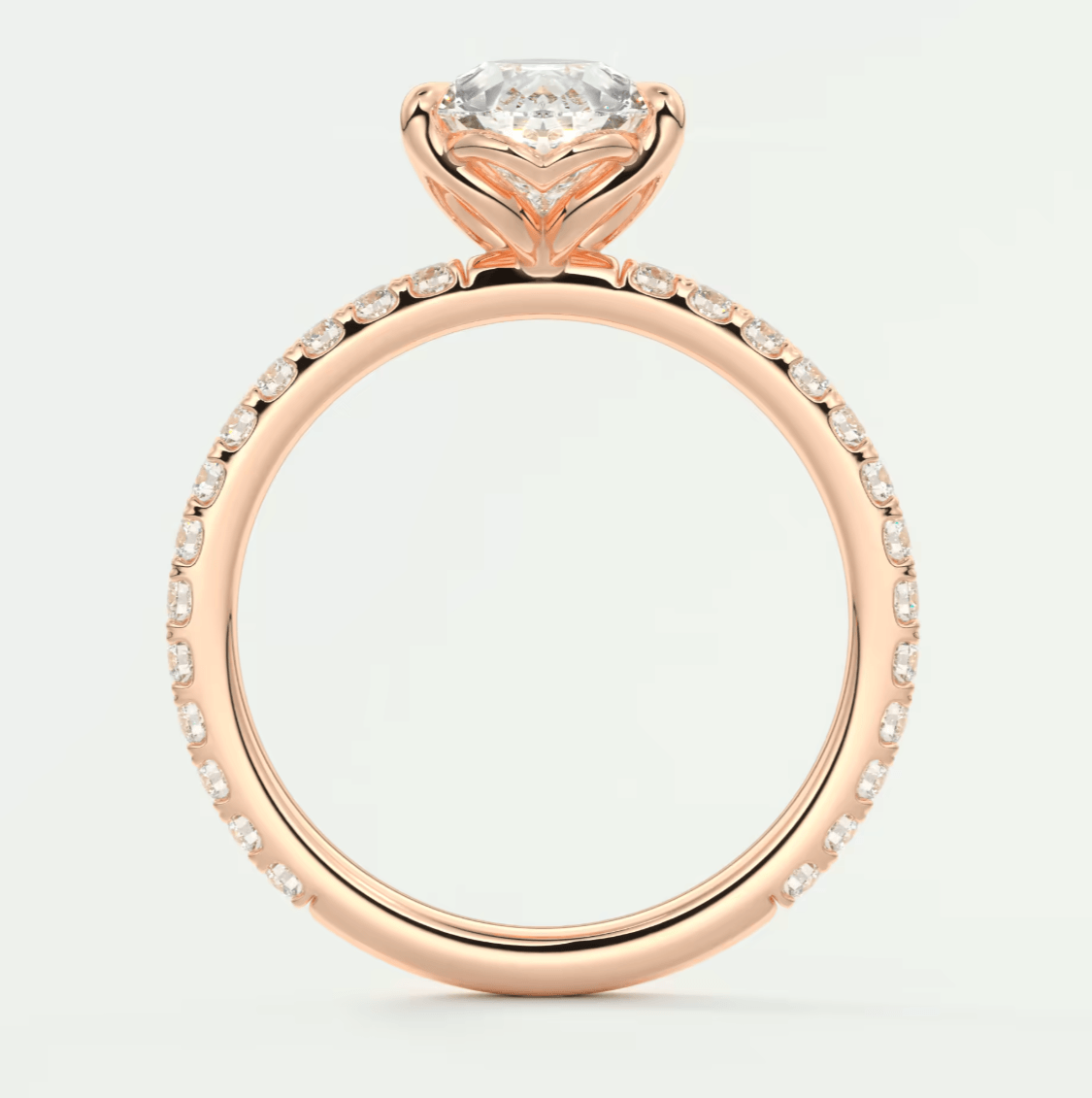 Rose gold diamond engagement ring with floral design and halo of smaller diamonds