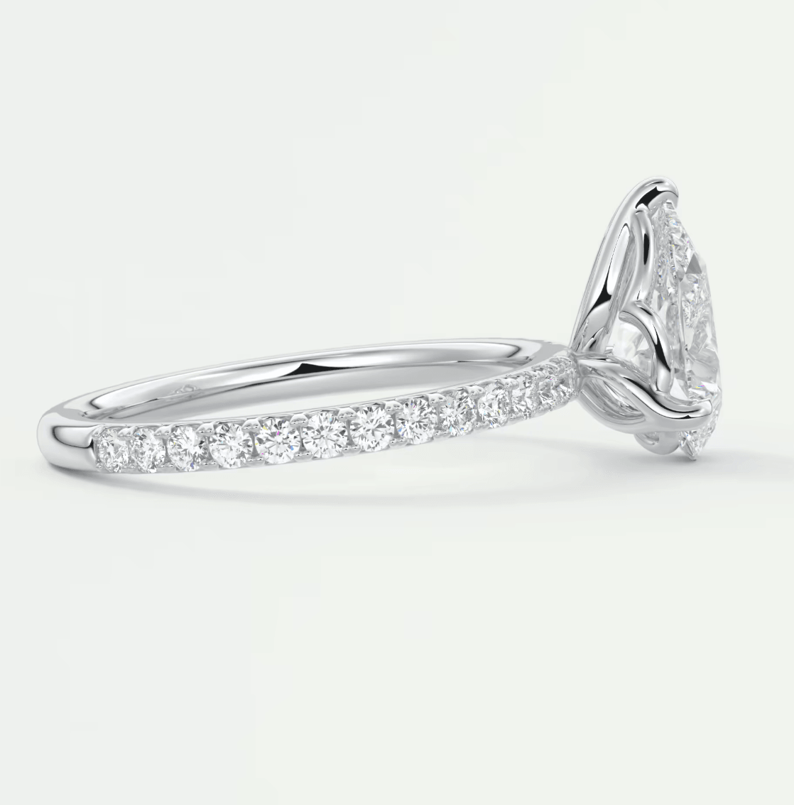 18k white gold diamond engagement ring with a halo setting and pave band.