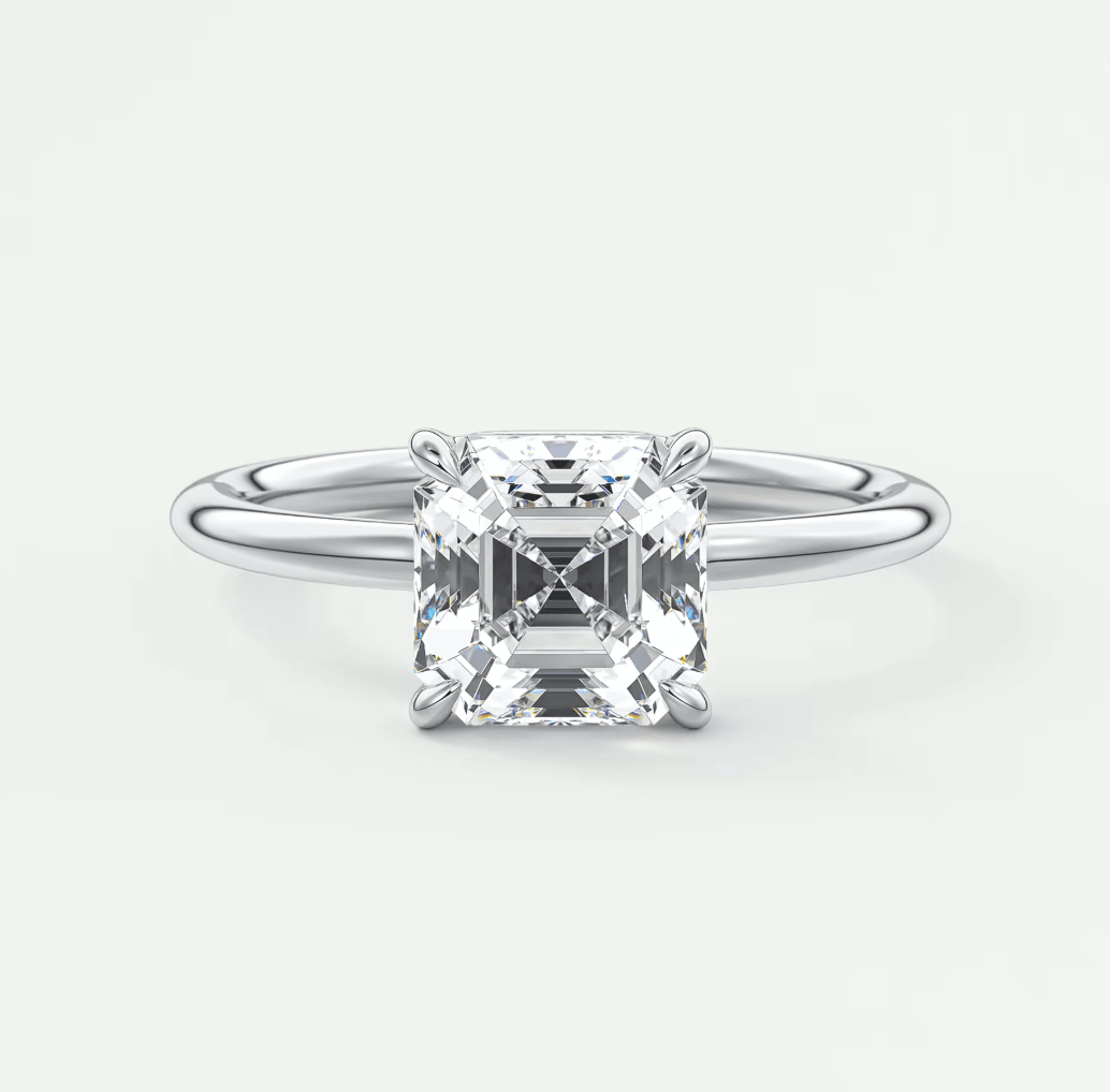 Princess cut diamond engagement ring with white gold band.