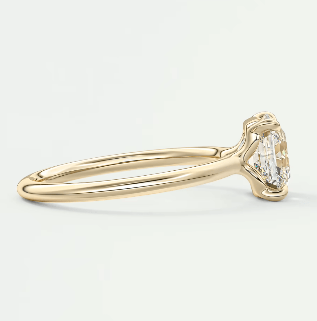 18k yellow gold engagement ring with a marquise-cut diamond.