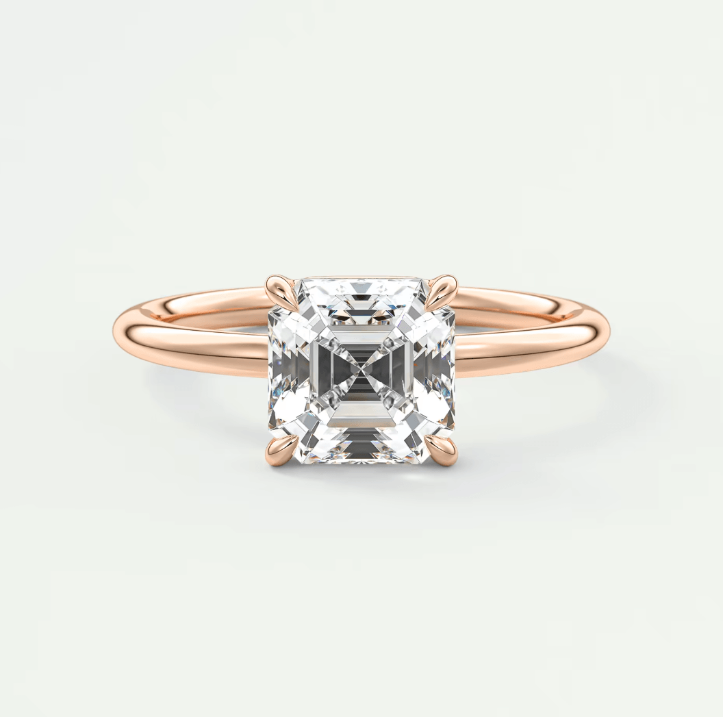 18-karat rose gold engagement ring with a princess-cut diamond.