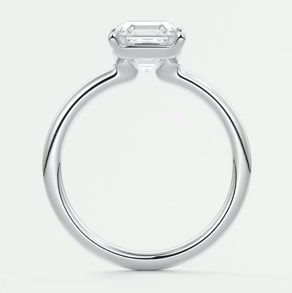 18k white gold emerald cut diamond engagement ring with a sleek, modern design.