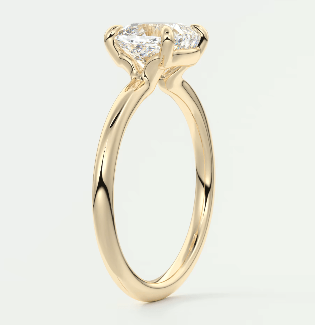 18k yellow gold engagement ring with a princess cut diamond.