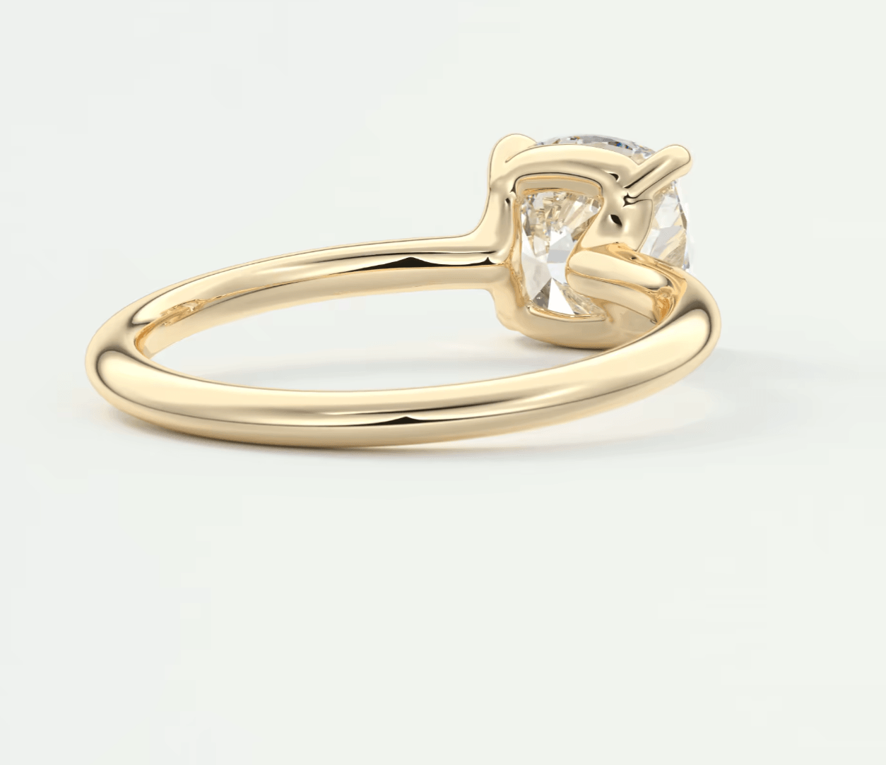 18k yellow gold engagement ring with a princess cut diamond.