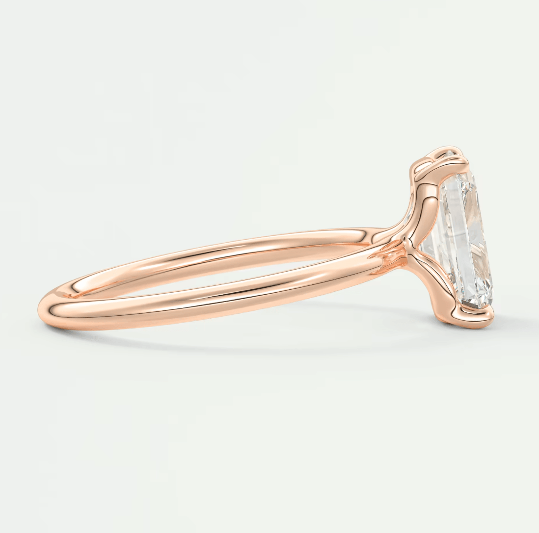 18k rose gold emerald cut diamond engagement ring.