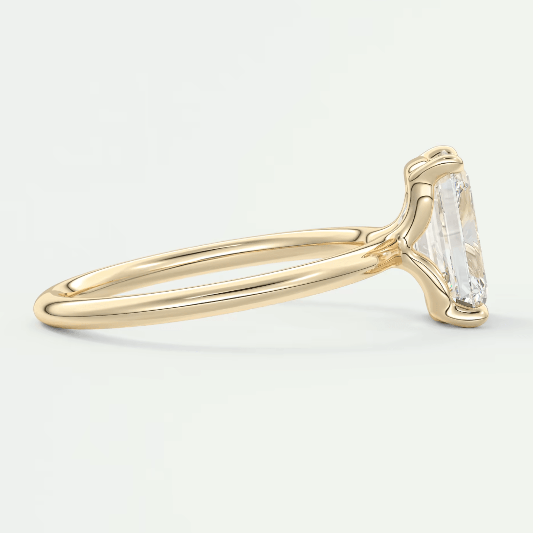 18k yellow gold emerald cut diamond engagement ring.