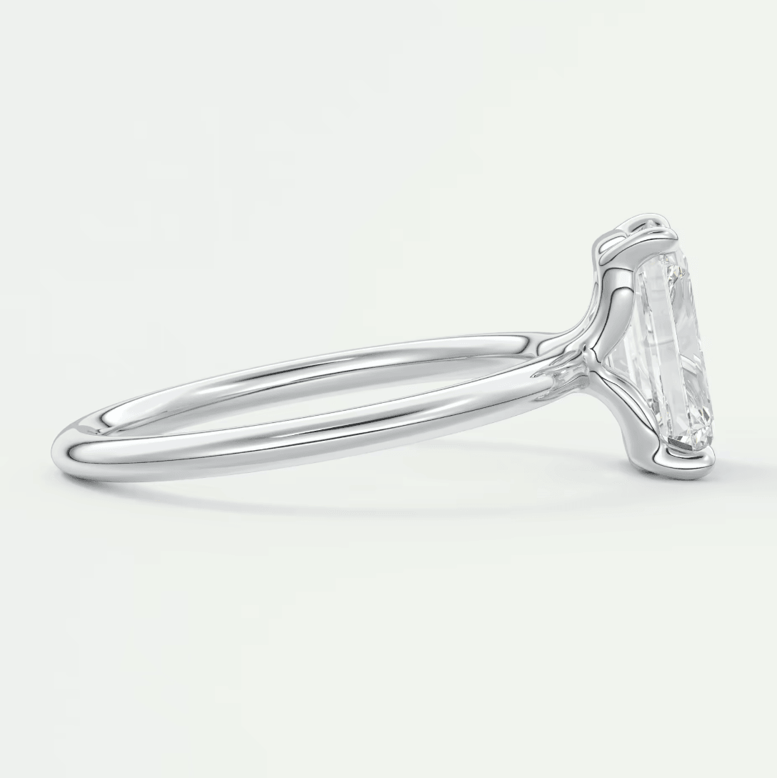 18k white gold solitaire engagement ring with a princess cut diamond.