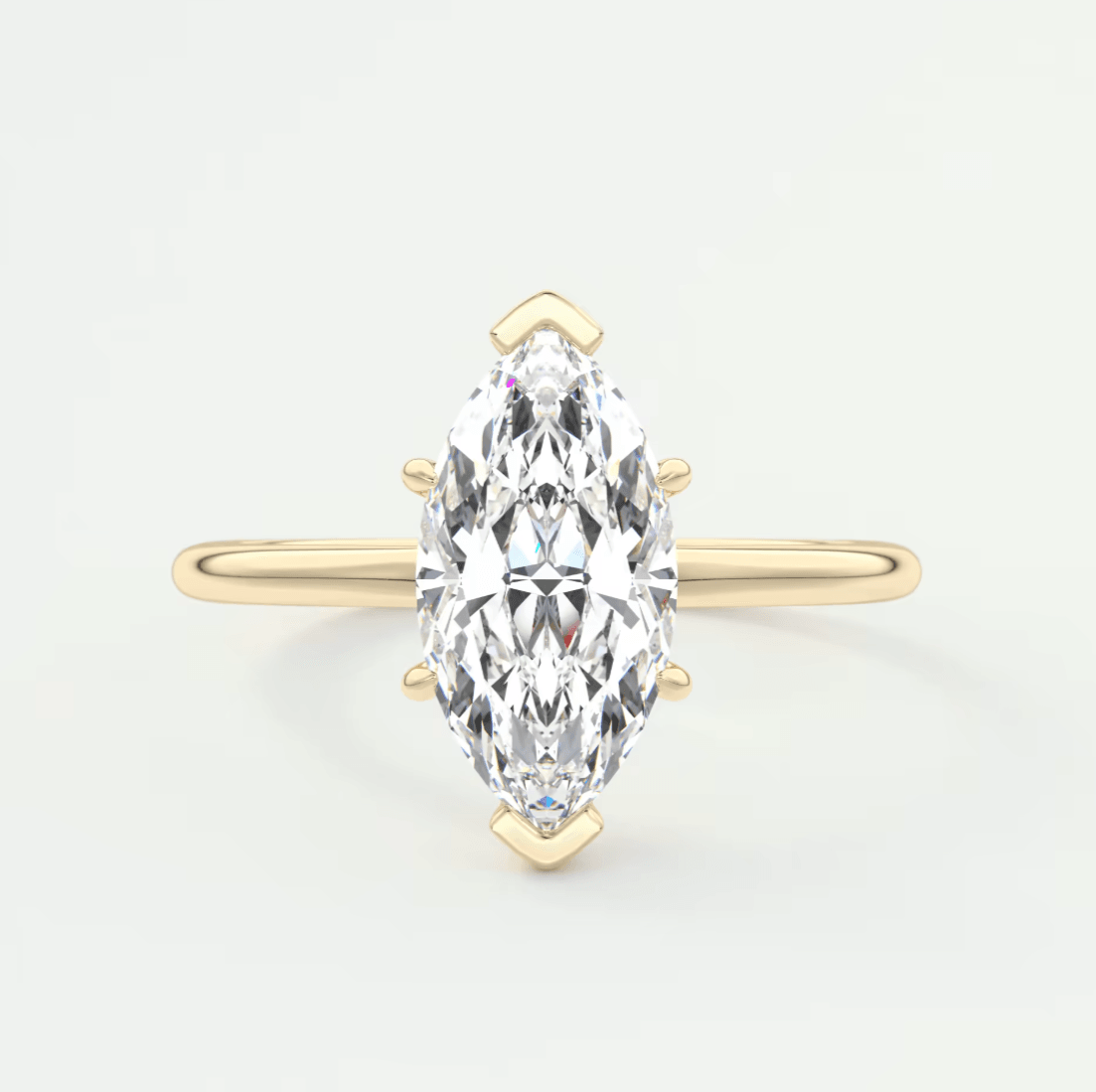 18-karat yellow gold marquise-cut diamond engagement ring.
