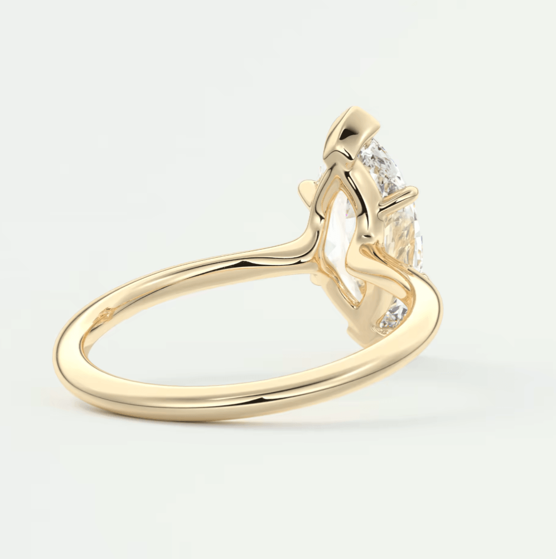 18k yellow gold engagement ring with a princess cut diamond and small accent diamonds.