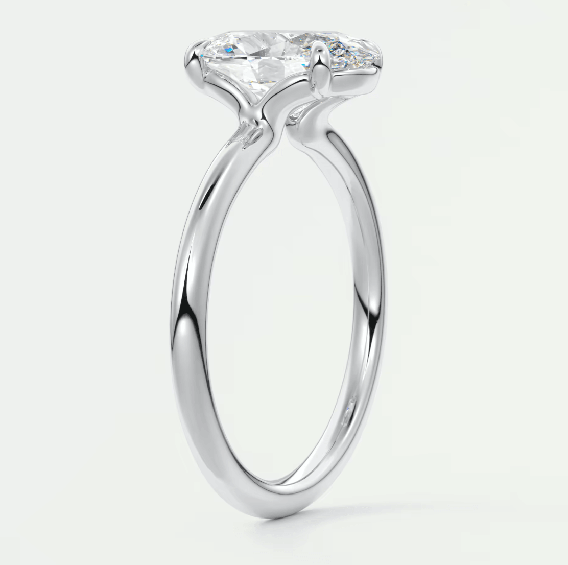 18-karat white gold engagement ring with a marquise-cut diamond.