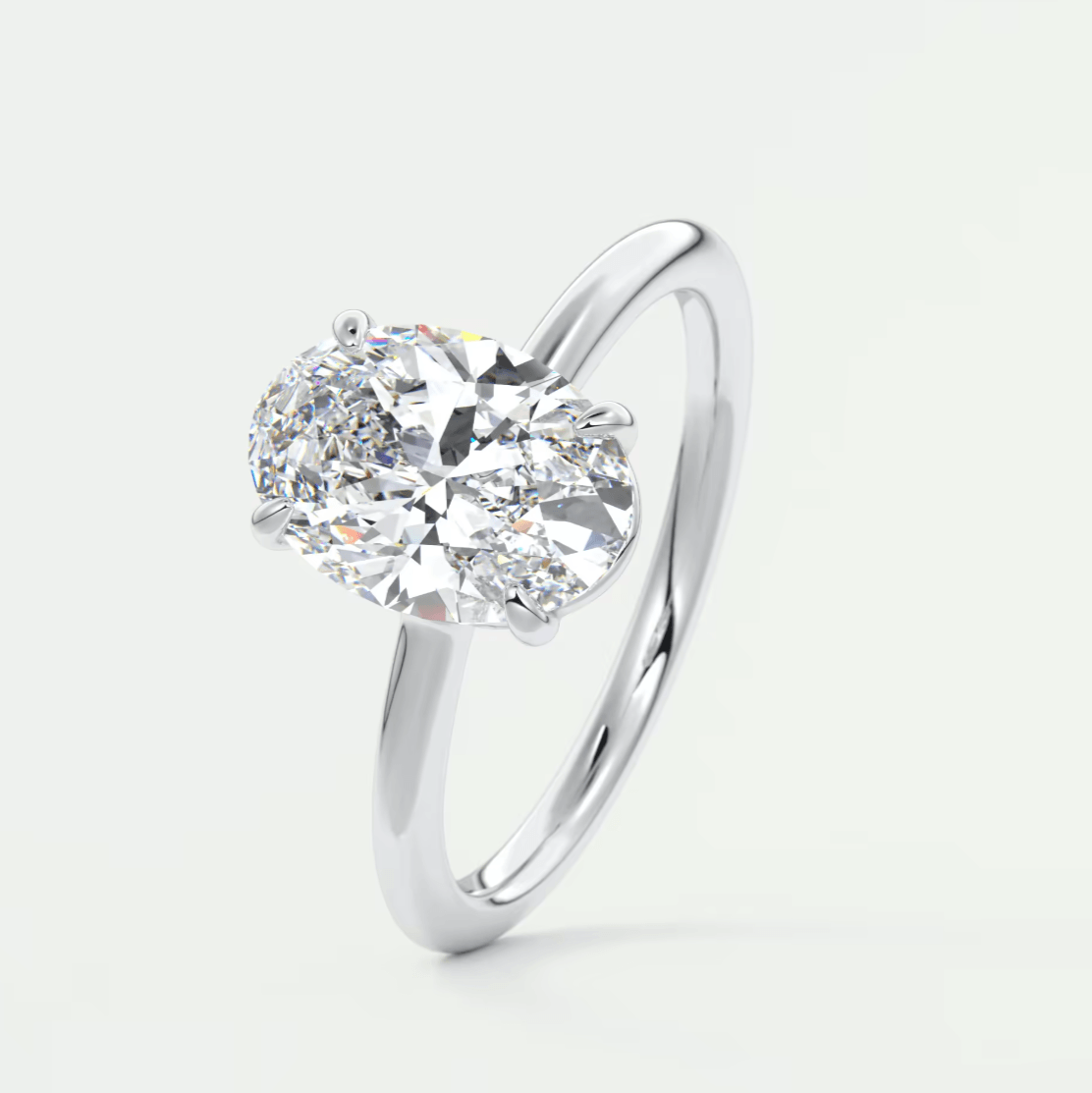 18-karat white gold solitaire diamond engagement ring.