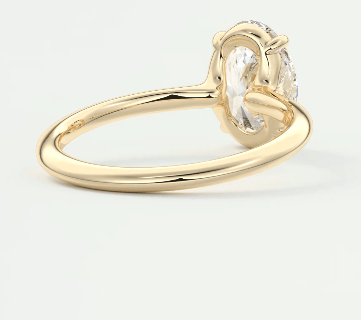 18k yellow gold engagement ring with a round diamond.