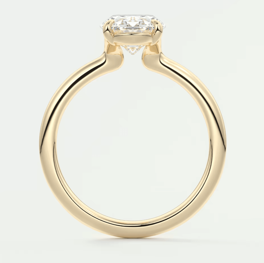 18k yellow gold engagement ring with an emerald-cut diamond.