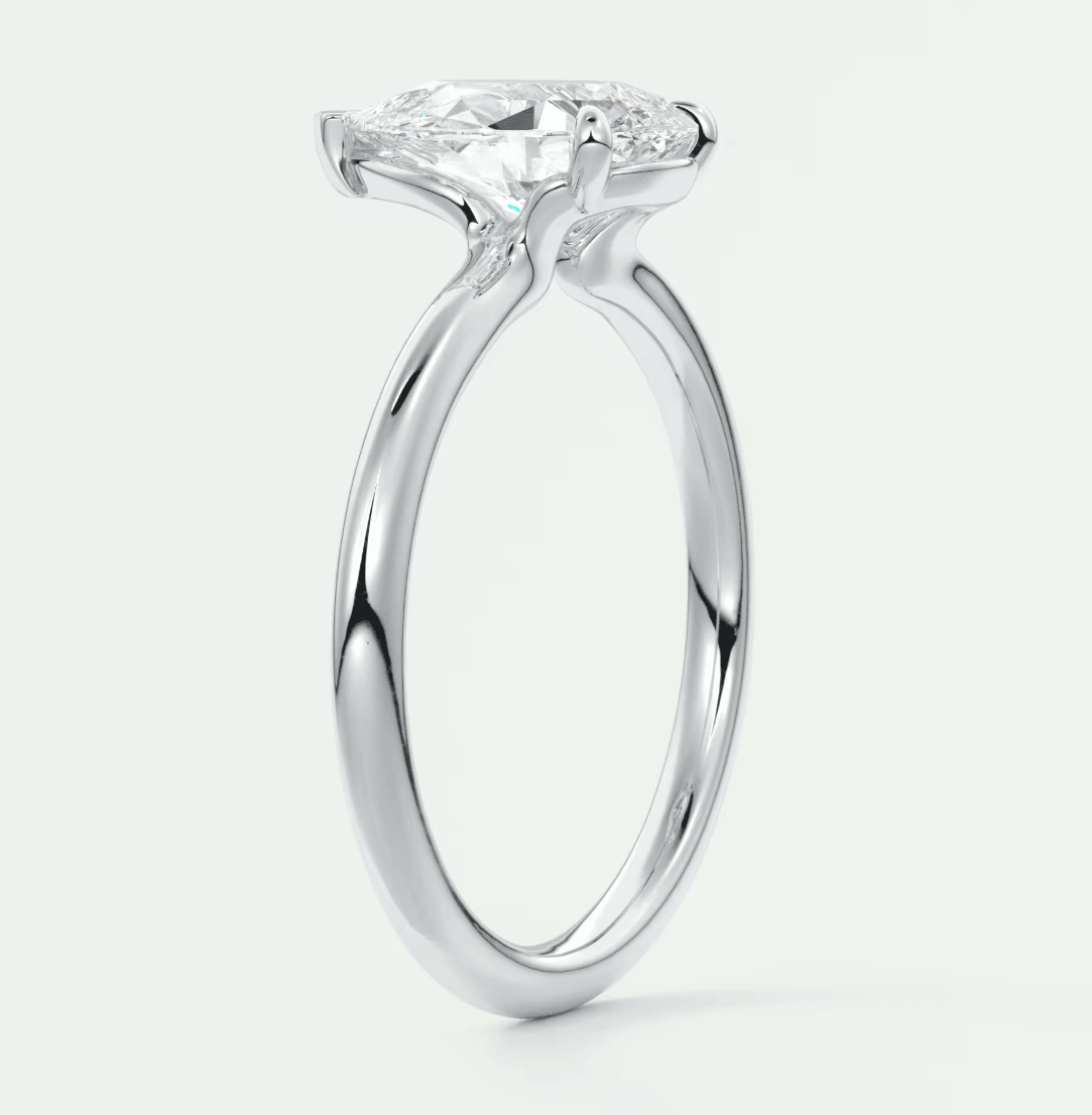 18-karat white gold engagement ring with a princess-cut diamond.