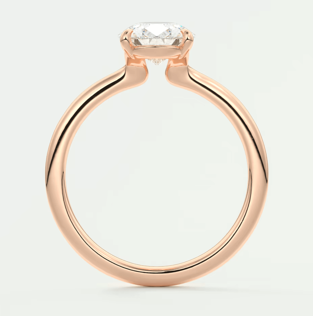 Rose gold engagement ring with a diamond center stone and elegant band design.