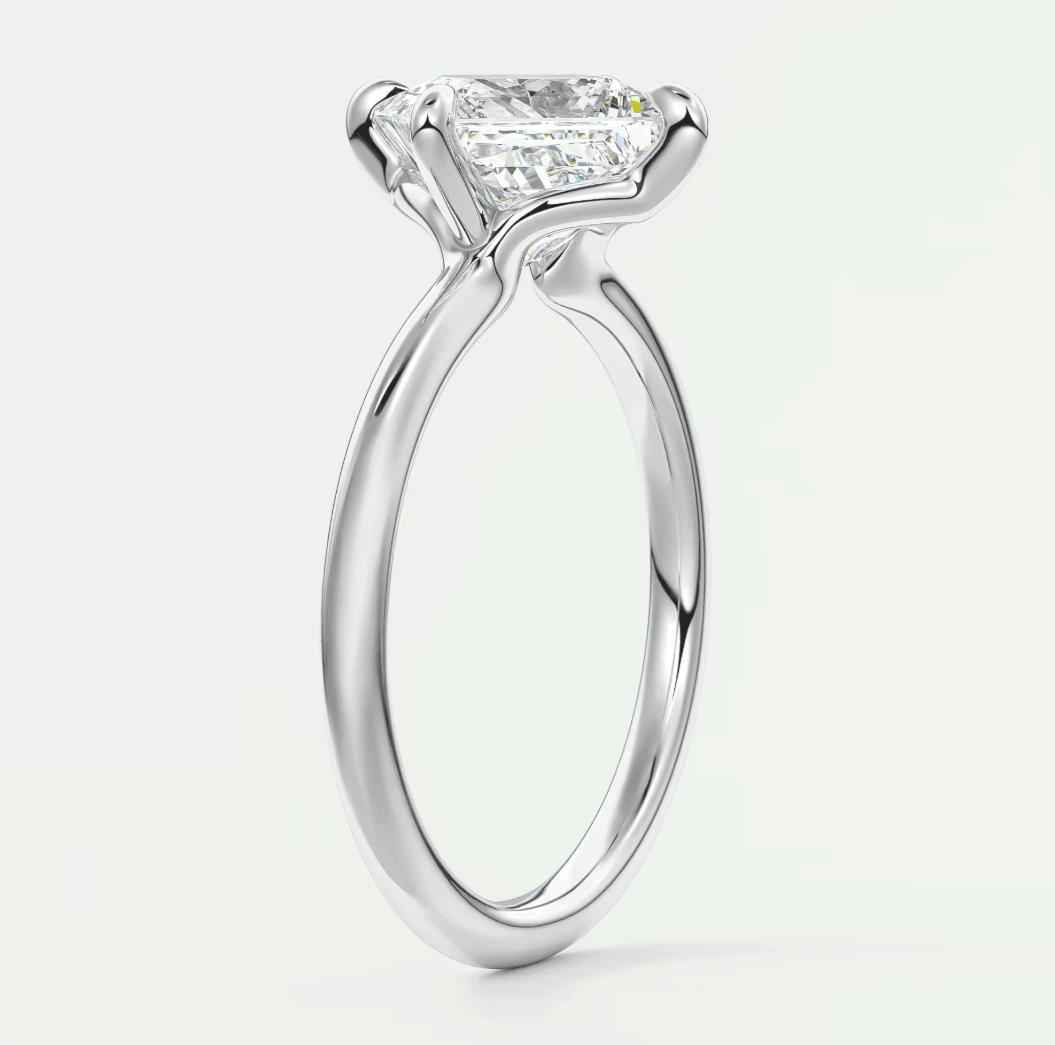 Princess cut diamond engagement ring with white gold band.