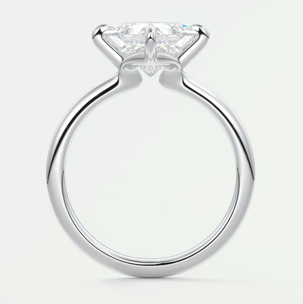 White gold solitaire engagement ring with princess cut diamond.