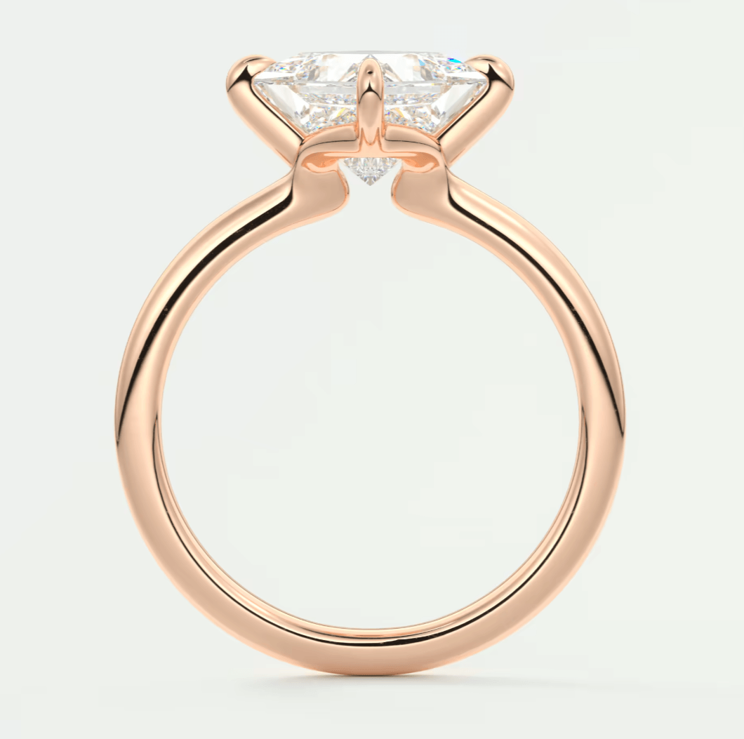 Rose gold engagement ring with a princess cut diamond.