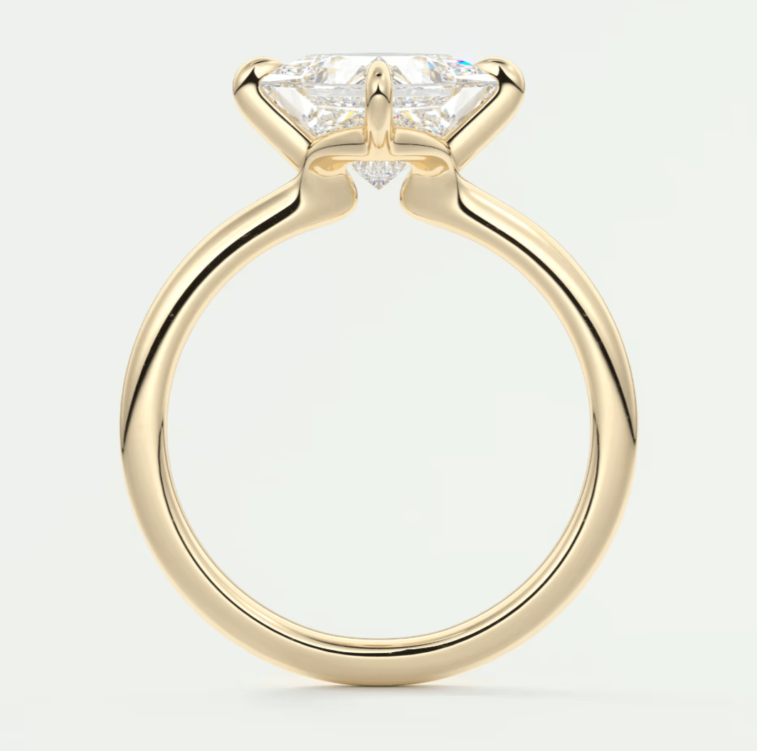 18k yellow gold solitaire engagement ring with a princess cut diamond.