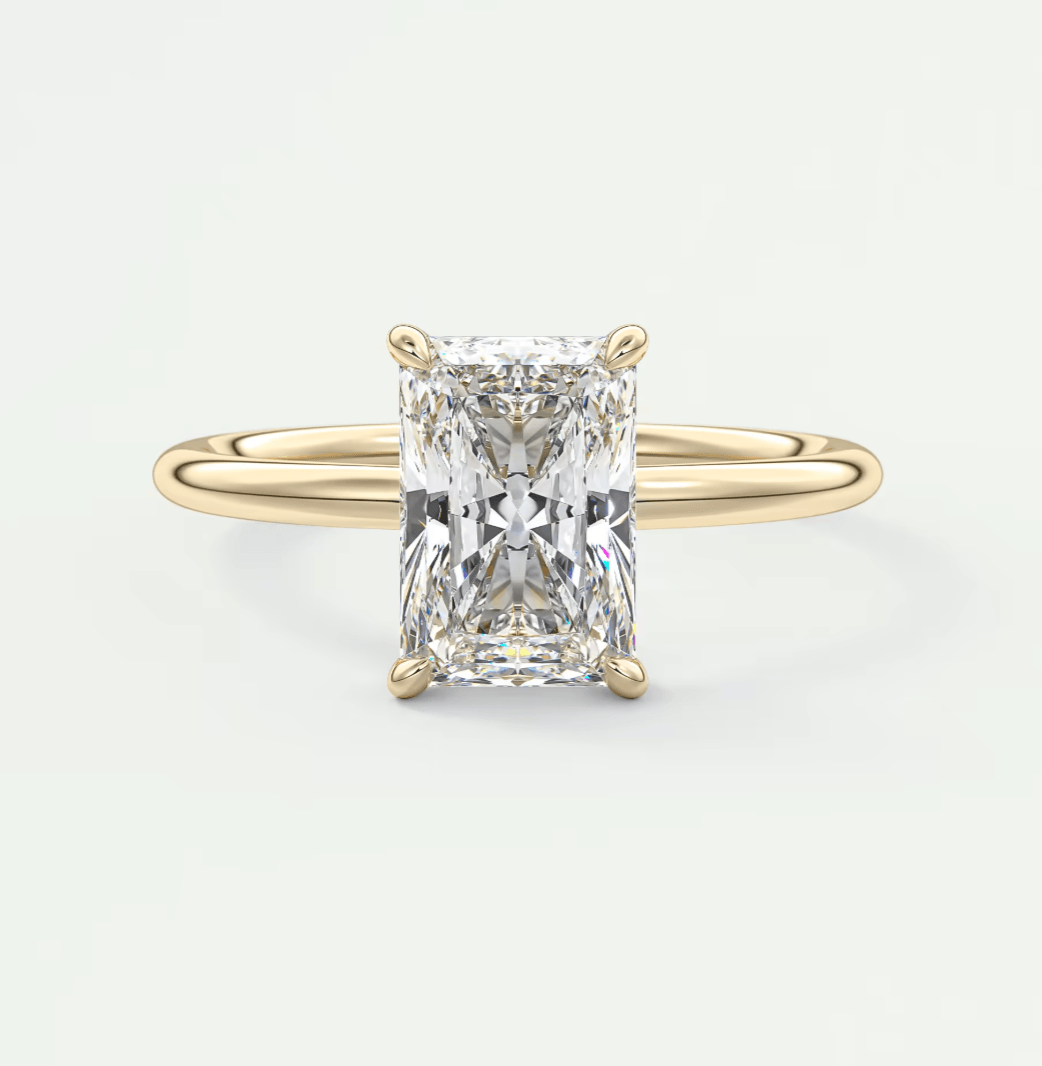 18k yellow gold emerald cut diamond engagement ring.