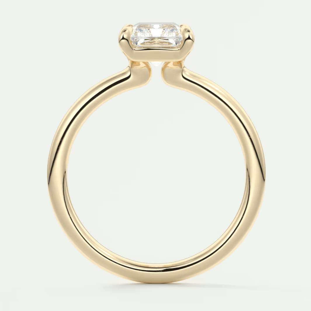 18k yellow gold engagement ring with a square-cut diamond.
