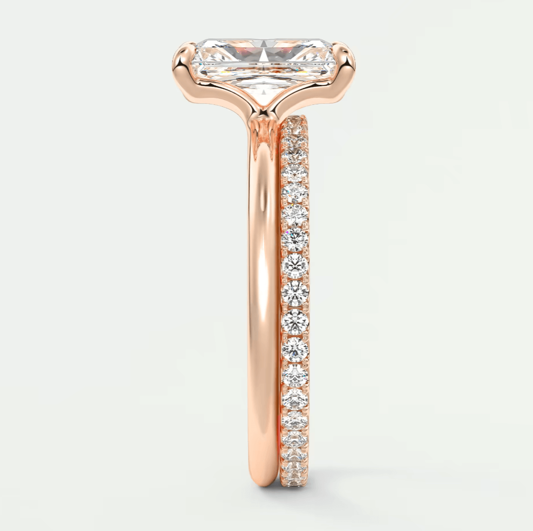 Rose gold engagement ring with princess cut diamond and pave set diamonds on band