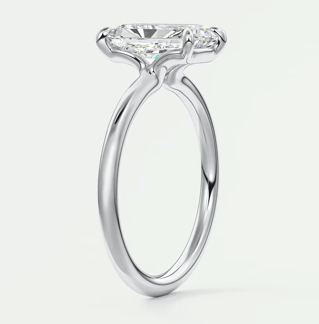 18k white gold solitaire engagement ring with a princess cut diamond.