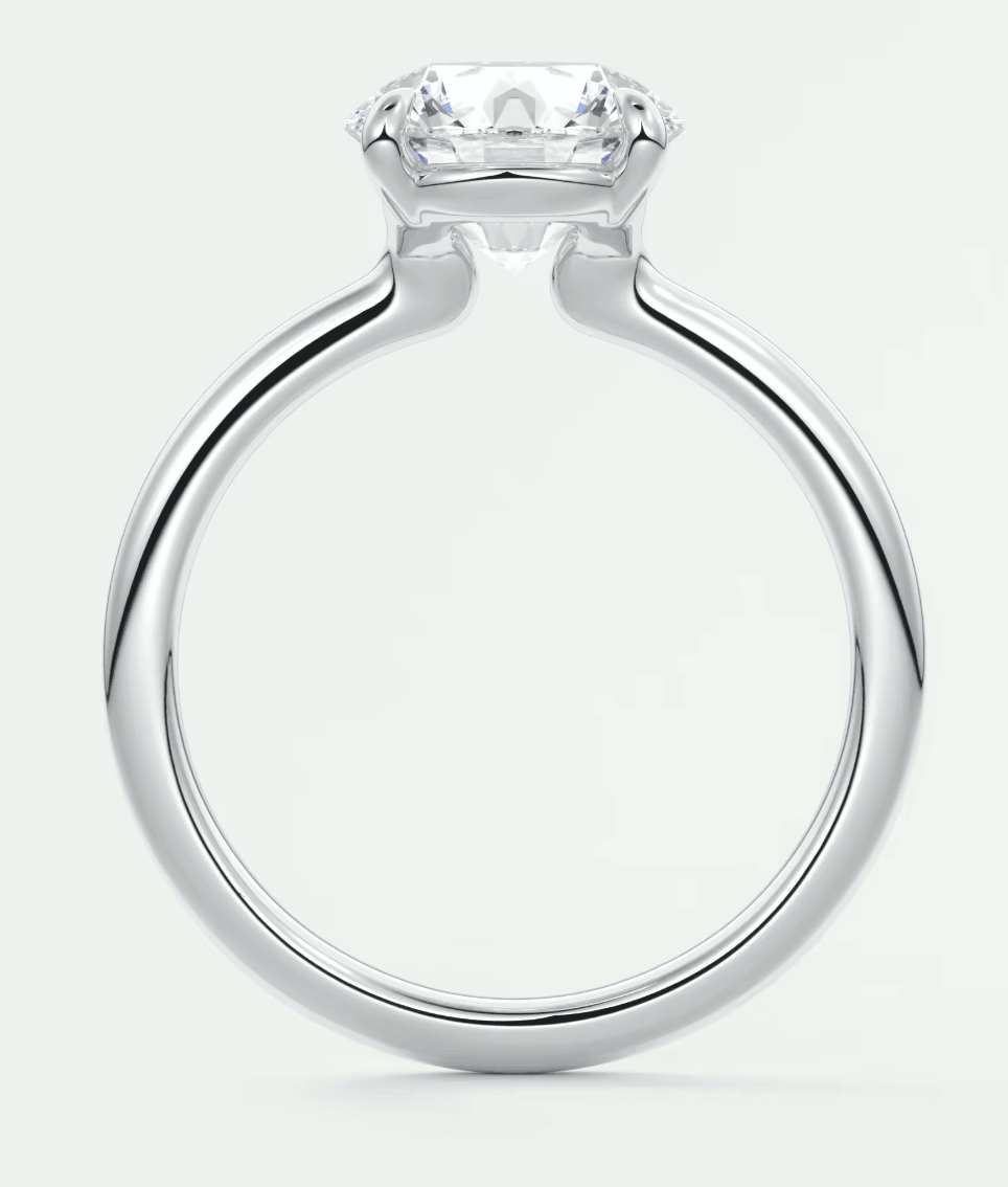 18k white gold diamond engagement ring with a round brilliant cut stone.