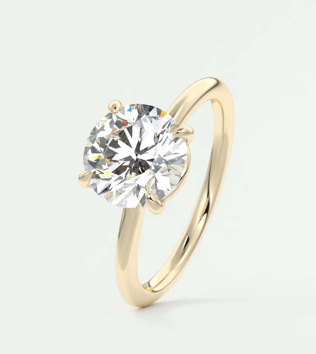 18k yellow gold solitaire diamond engagement ring.
