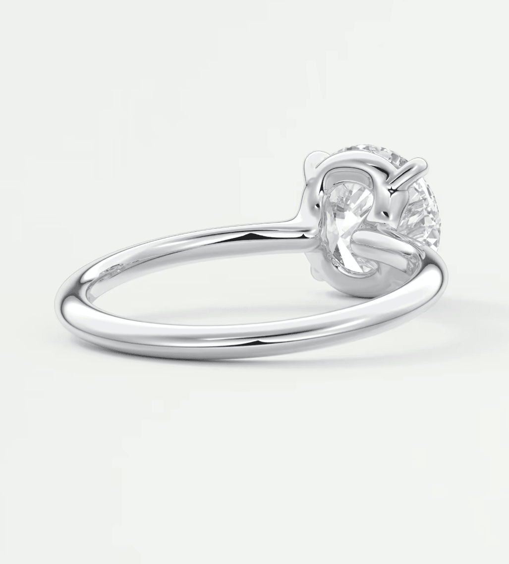 18-karat white gold solitaire diamond engagement ring.