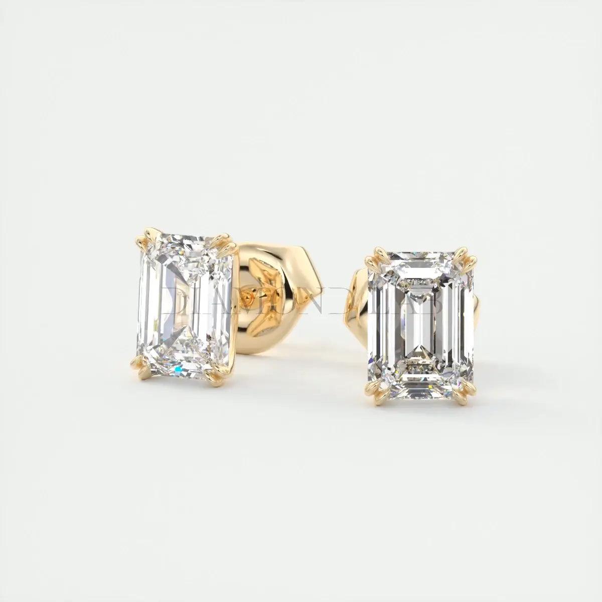18k yellow gold emerald-cut diamond stud earrings.