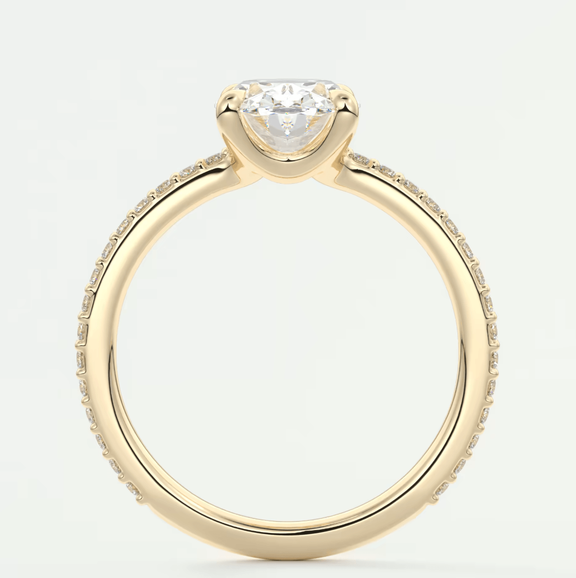 18k yellow gold engagement ring with a princess cut diamond and pave set diamonds on the band.