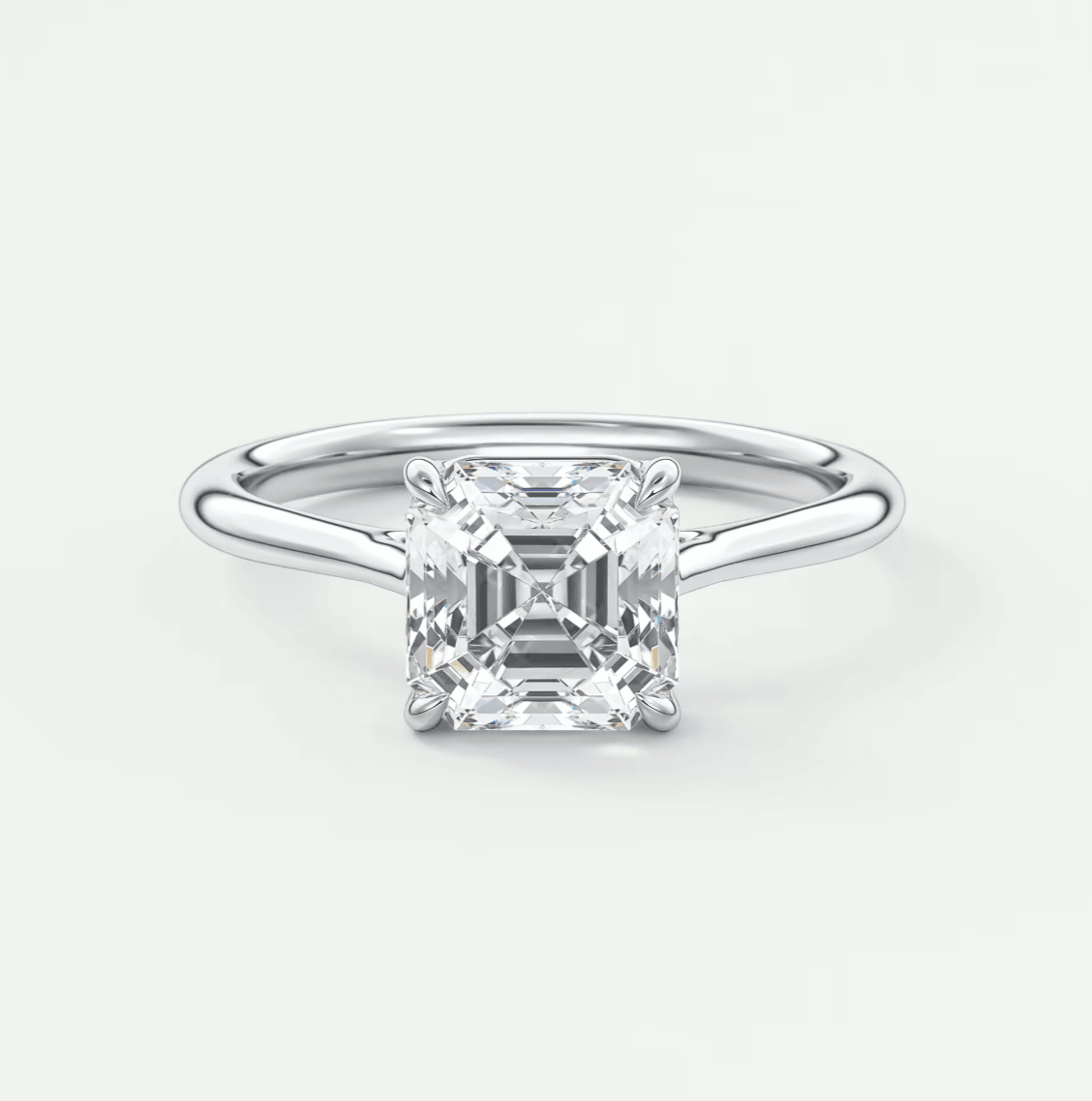 18-karat white gold engagement ring with a princess-cut diamond.