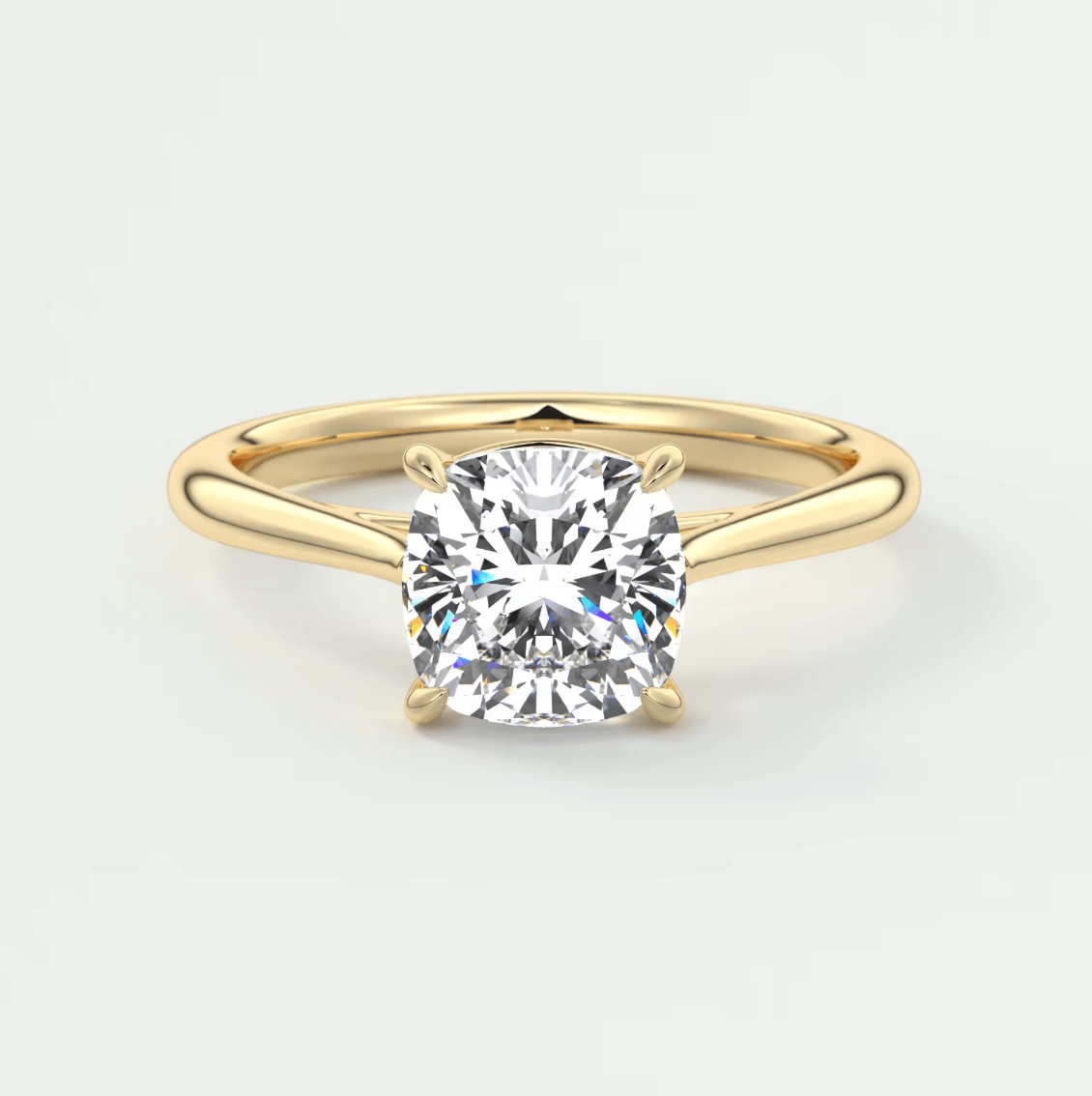 18k yellow gold cushion-cut diamond engagement ring.