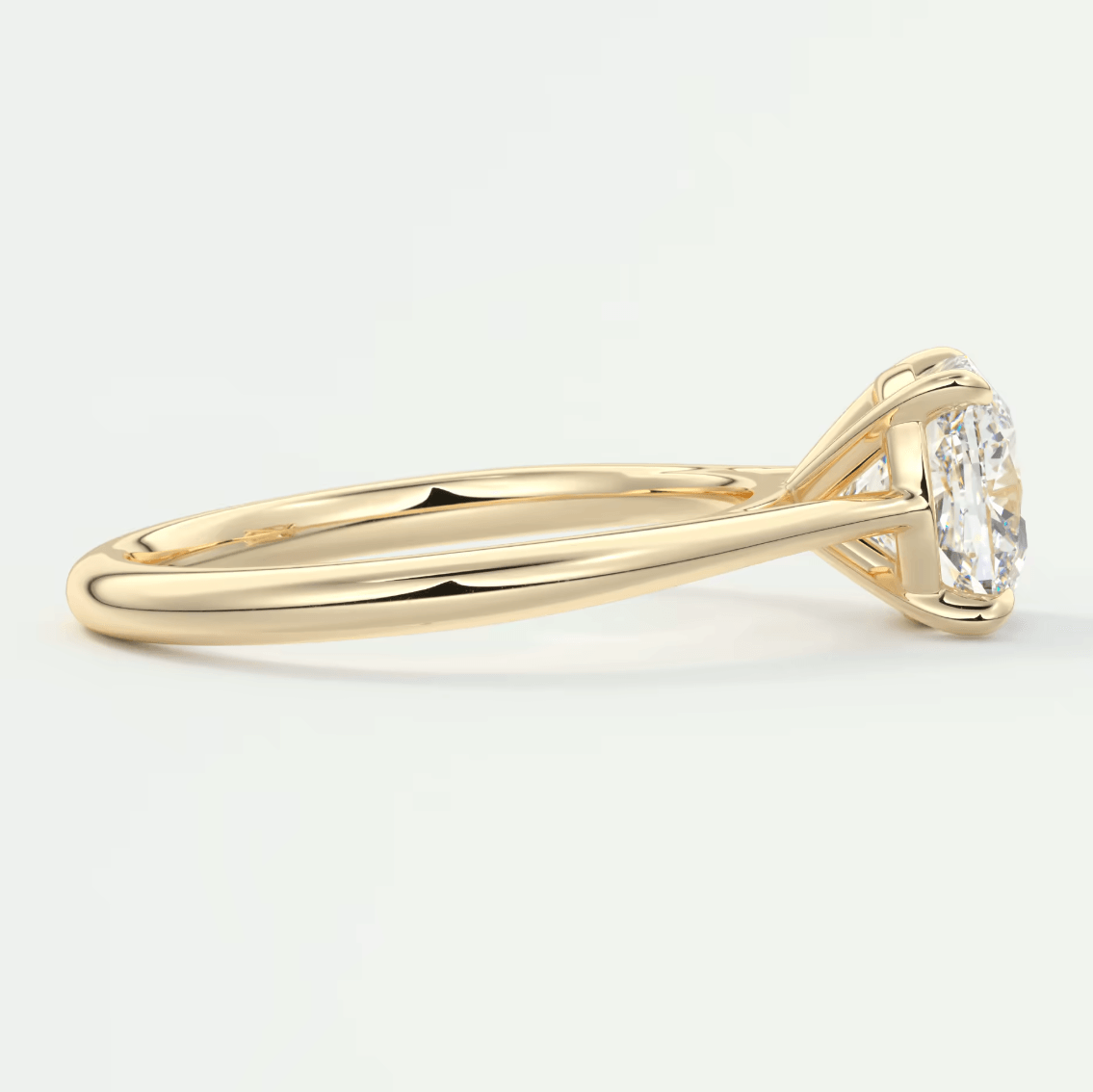 18k yellow gold diamond engagement ring with a round brilliant cut stone.