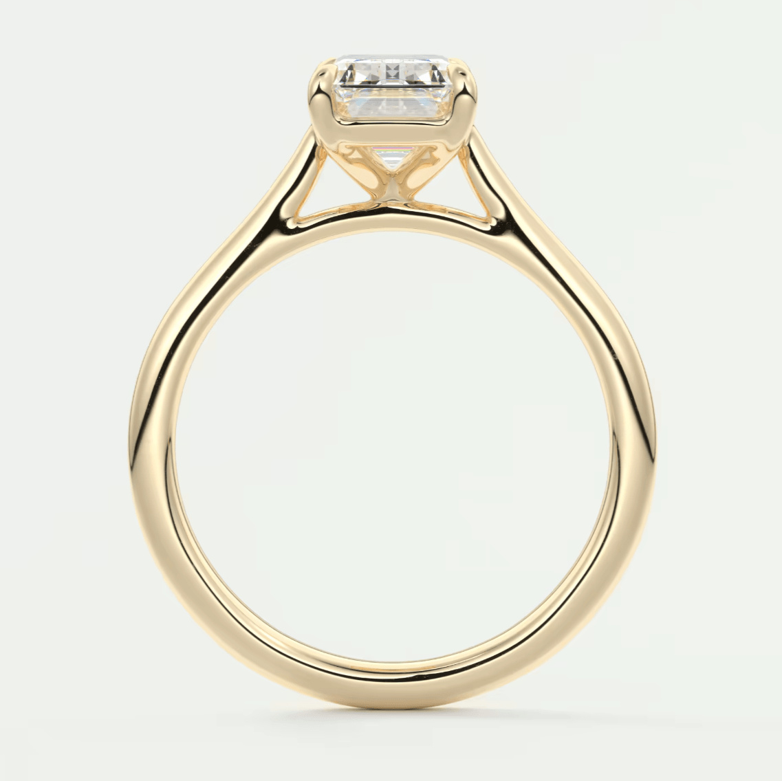 18k yellow gold engagement ring with a princess cut diamond and small side diamonds.