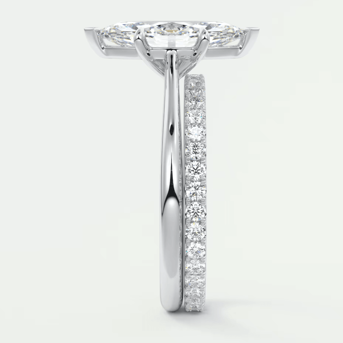 18-karat white gold diamond engagement ring with a princess-cut center stone and channel-set diamonds on the band.