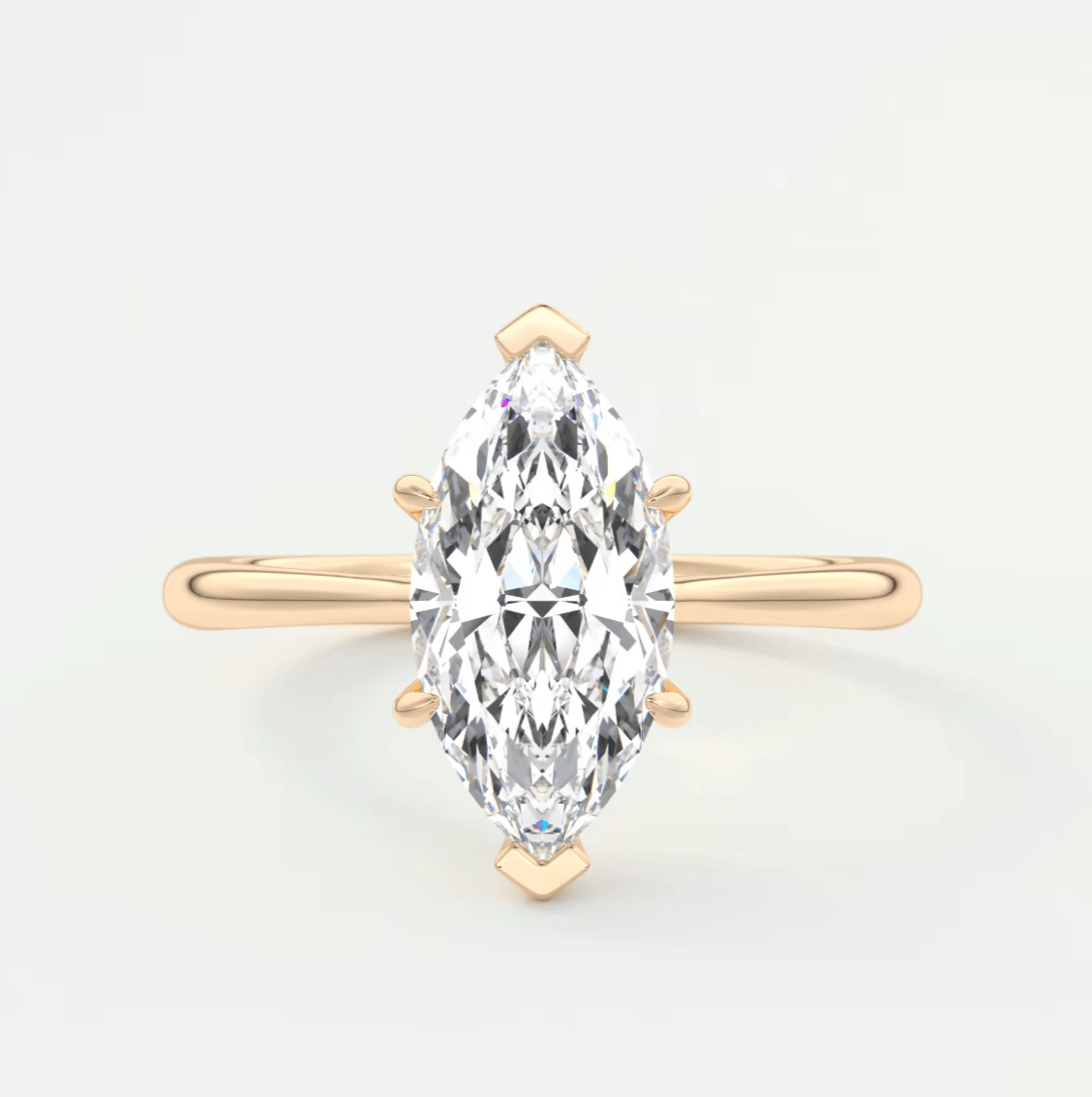 18-karat gold marquise-cut diamond engagement ring with a single-stone setting.