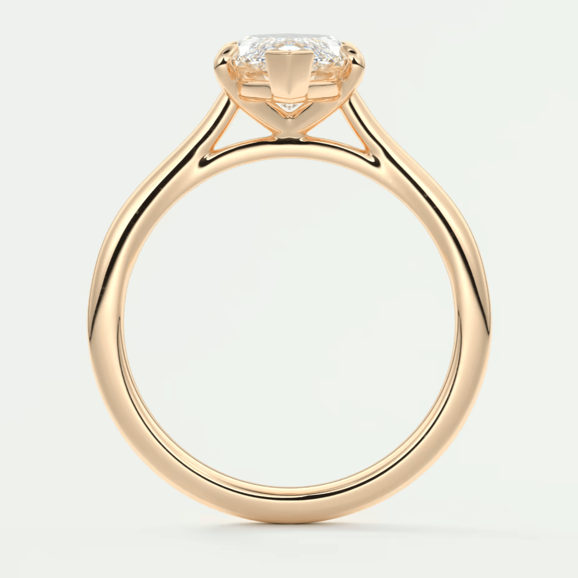 18-karat rose gold engagement ring with a cushion-cut diamond.