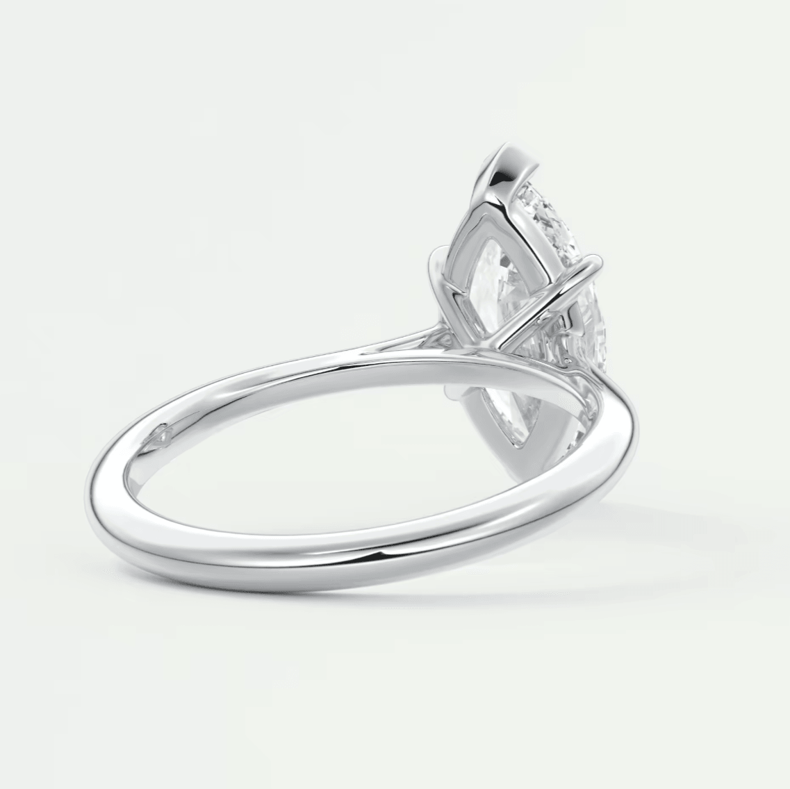 18-karat white gold engagement ring with a marquise-cut diamond.