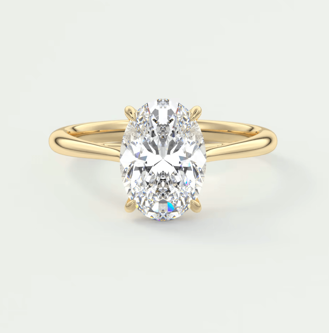 18k yellow gold oval diamond engagement ring with a solitaire design.