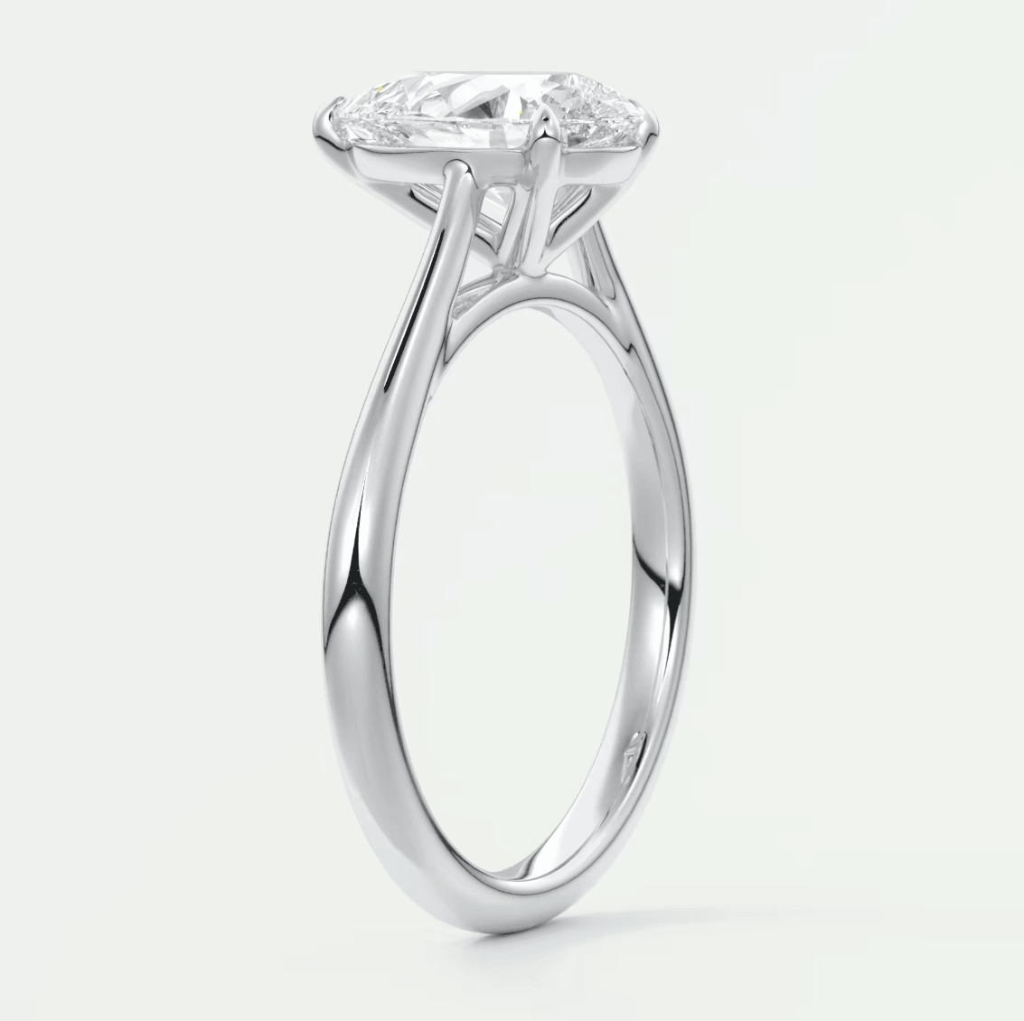 18-karat white gold engagement ring with a princess-cut diamond.
