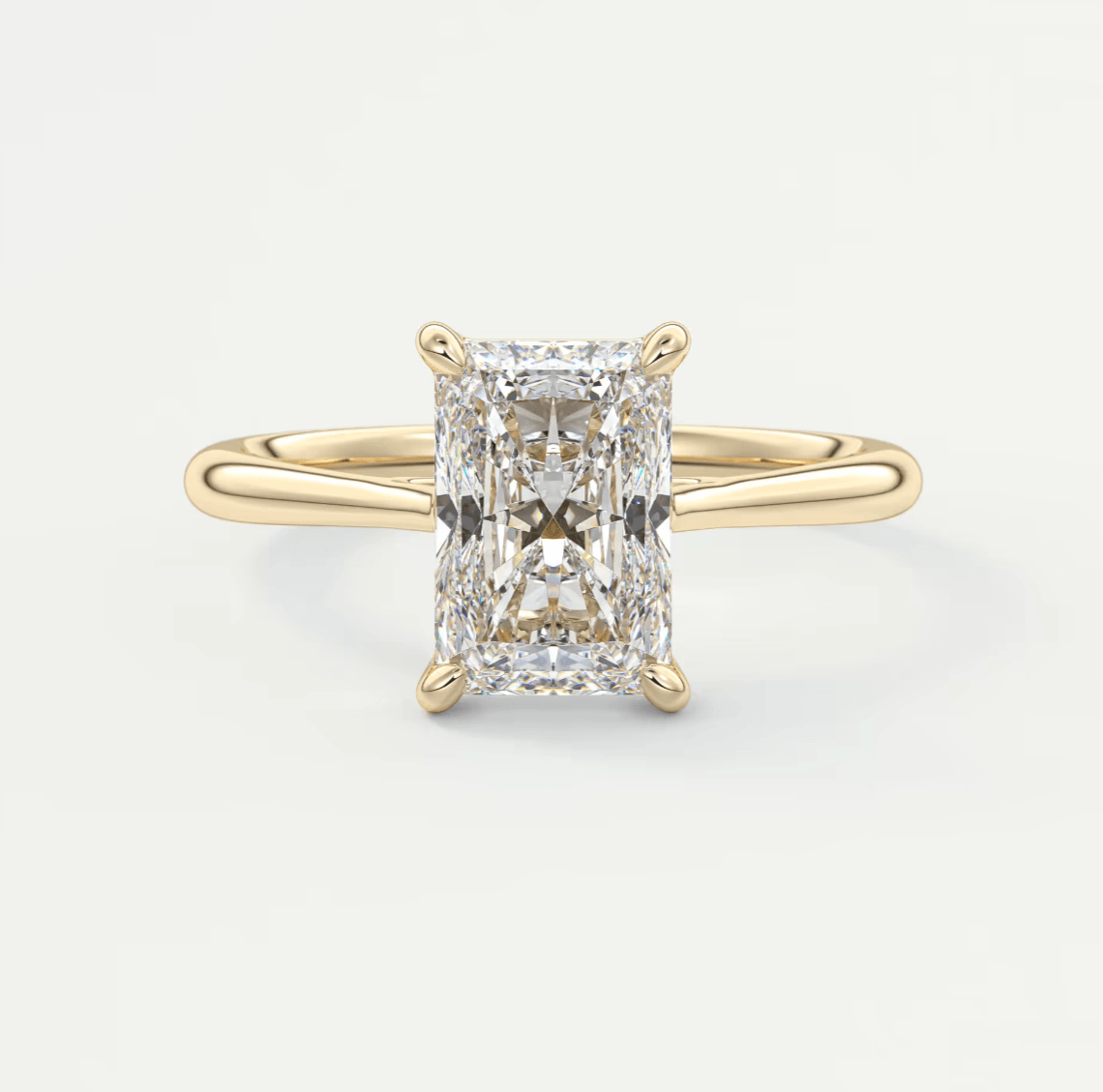 18k yellow gold emerald cut diamond engagement ring.