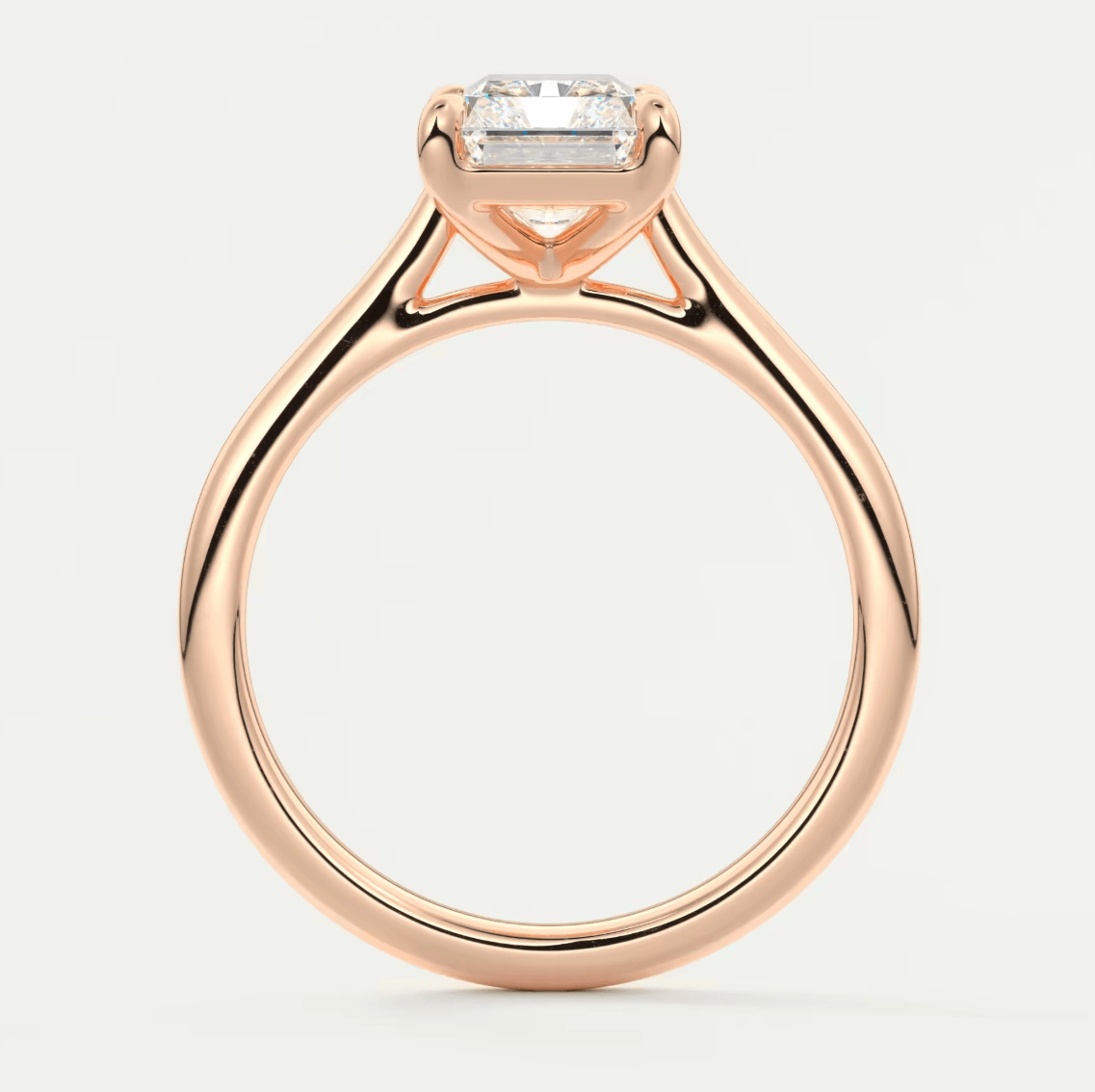 18-karat rose gold engagement ring with a princess-cut diamond.