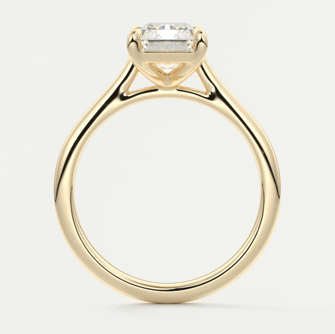 18-karat yellow gold engagement ring with a princess-cut diamond.