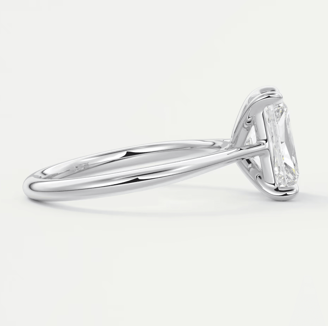 18k white gold engagement ring with a marquise-cut diamond.