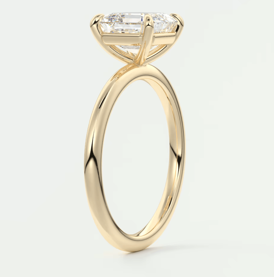 18k yellow gold engagement ring with a princess cut diamond.
