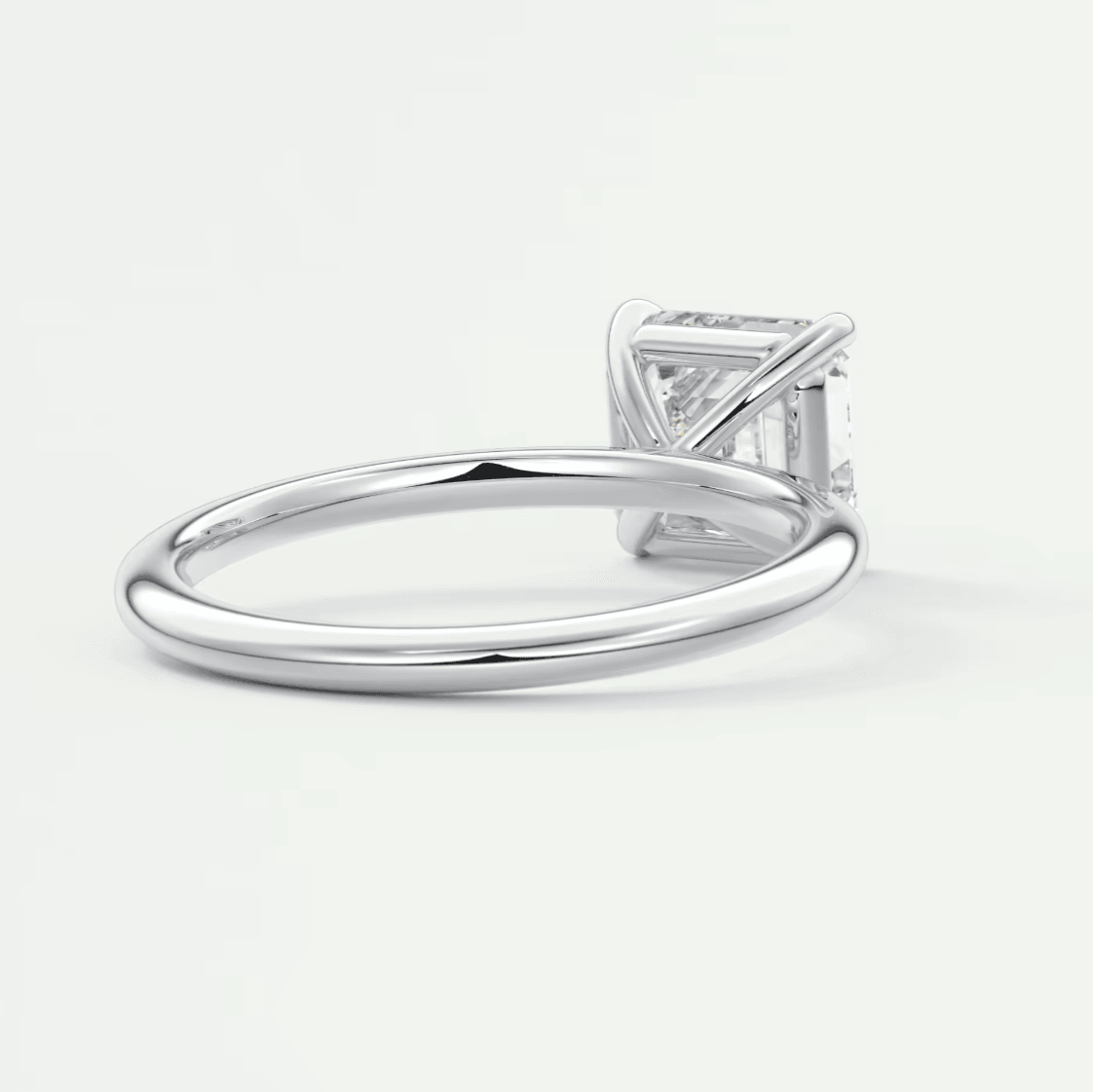 White gold princess cut diamond engagement ring with a sleek band design.