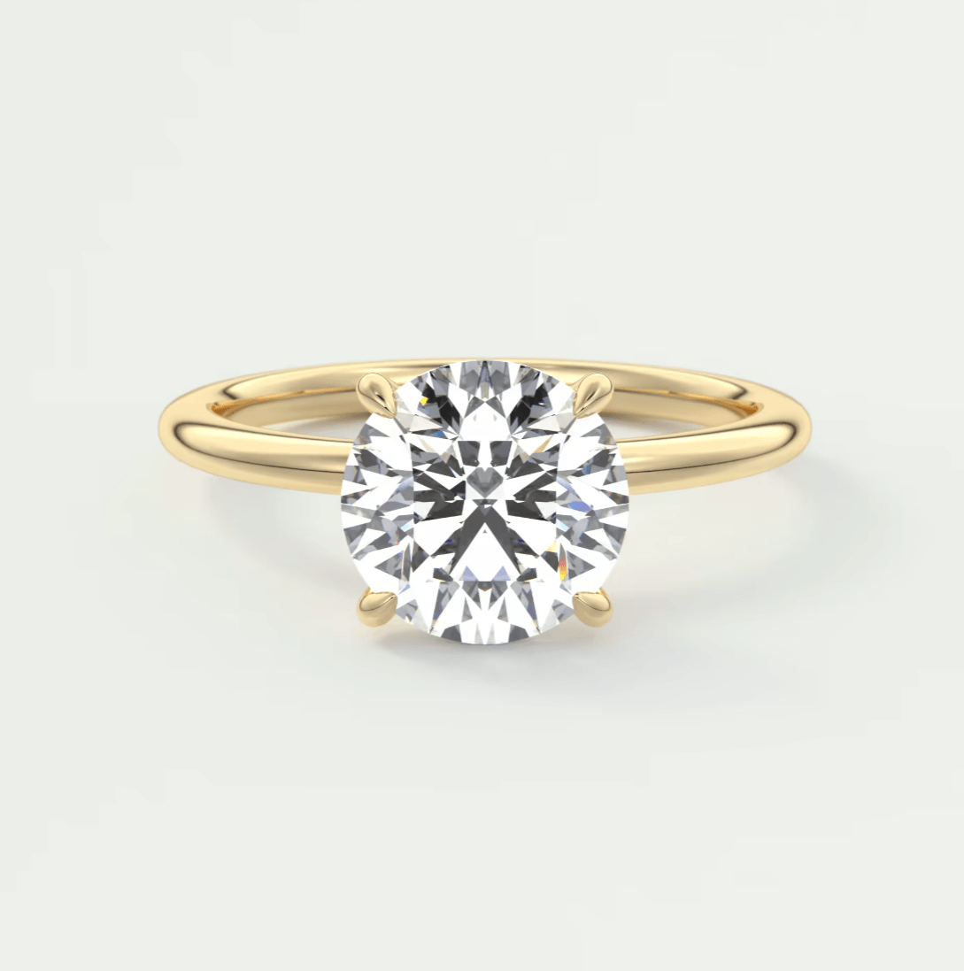 18k yellow gold solitaire diamond engagement ring.